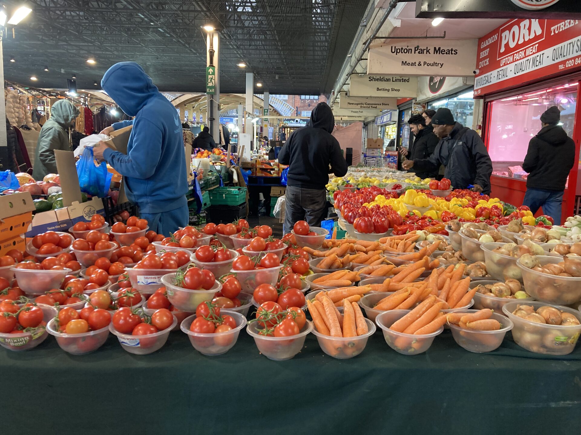 A market trader selling fruit and veg in Newham, London